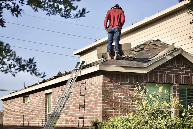 Professional roofer working on a residential roof in Shady Grove